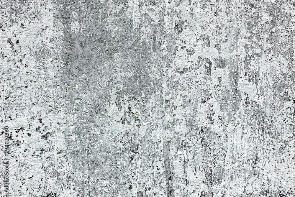 Texture of a concrete wall with cracks and scratches which can be used as a background Texture of a concrete wall with cracks and scratches which can be used as a background