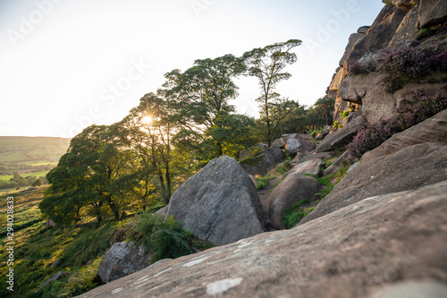 Sunset over Gritstone Rocks in Peak District, UK photo