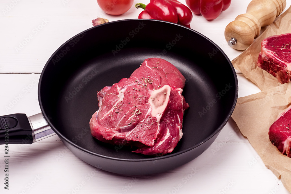 Fresh Raw Beef Meat on Pan Steak White Wooden Background Above