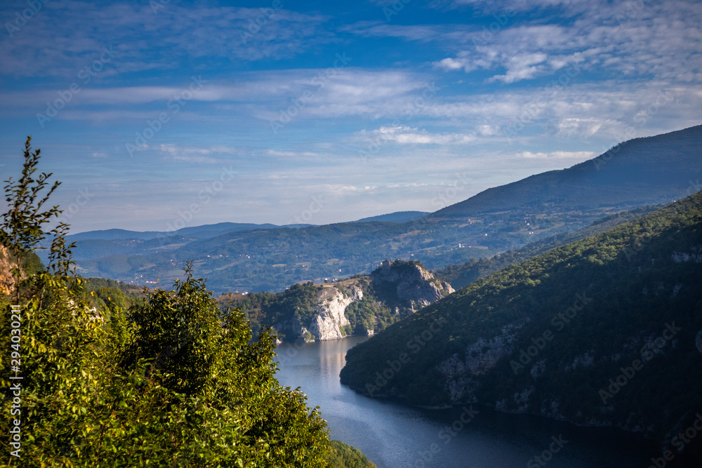 River surrounded by the hills and mountains. Vrbas river in Bosnia and Herzegovina.