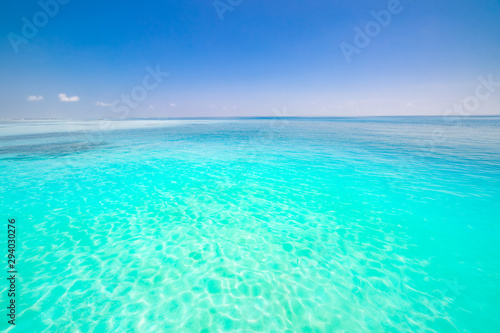 Caribbean panorama Hawaiian Maldivian coast with a boat in a turquoise tropical sea. 