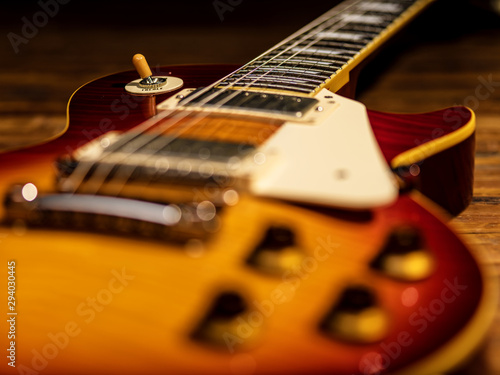 electric guitar body close-up view is on the wood floor