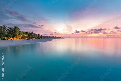 Closeup of sea beach and colorful sunset sky. Panoramic beach landscape. Empty tropical beach and seascape. Orange and golden sunset sky  soft sand  calmness  tranquil relaxing sunlight  summer mood