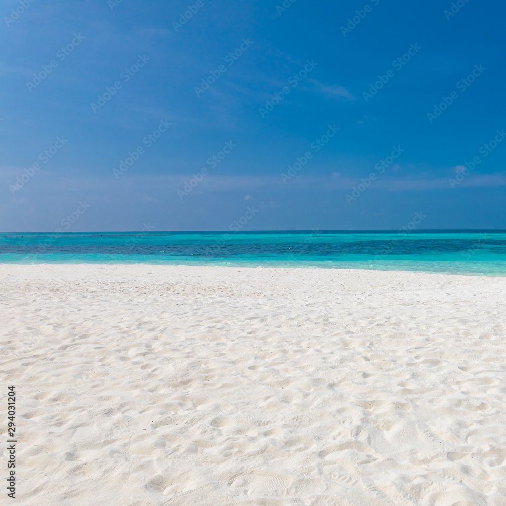 Empty beach landscape seascape. Blue sky over white sand near tropical sea. Exotic island view, summer beach