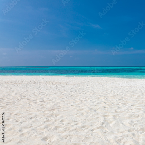Empty beach landscape seascape. Blue sky over white sand near tropical sea. Exotic island view  summer beach
