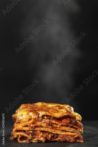 portion of lasagna on a plate photo