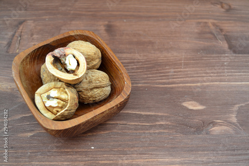Healthy eating : walnuts in rustic wooden bowl. Fitness concept.