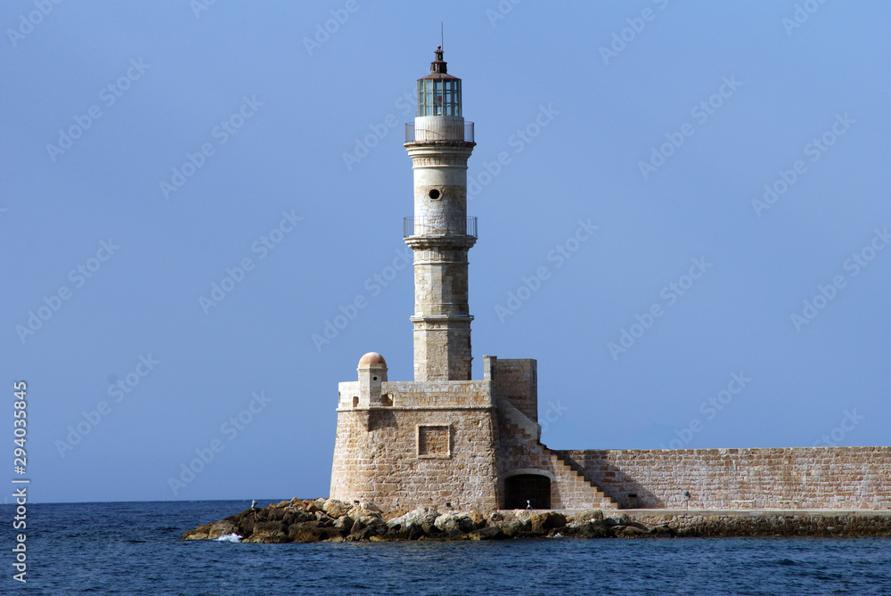 sea lighthouse on a background of blue sea