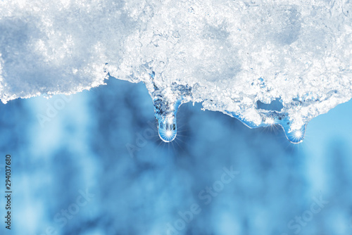 closeup of melting snow with sun reflection