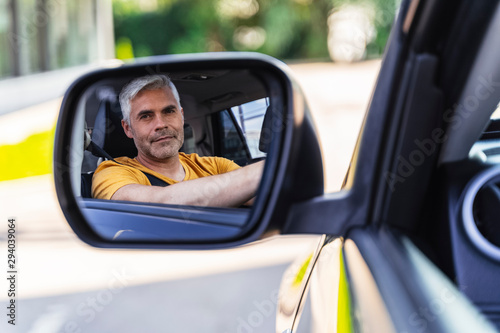 Handsome Caucasian man is ready for driving his new car