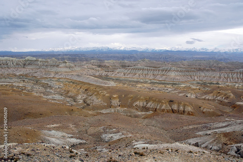 Badlands landscape in Satlej river valley and view at Himalayas. Tibetan Plateau, Tibet, China, Asia..