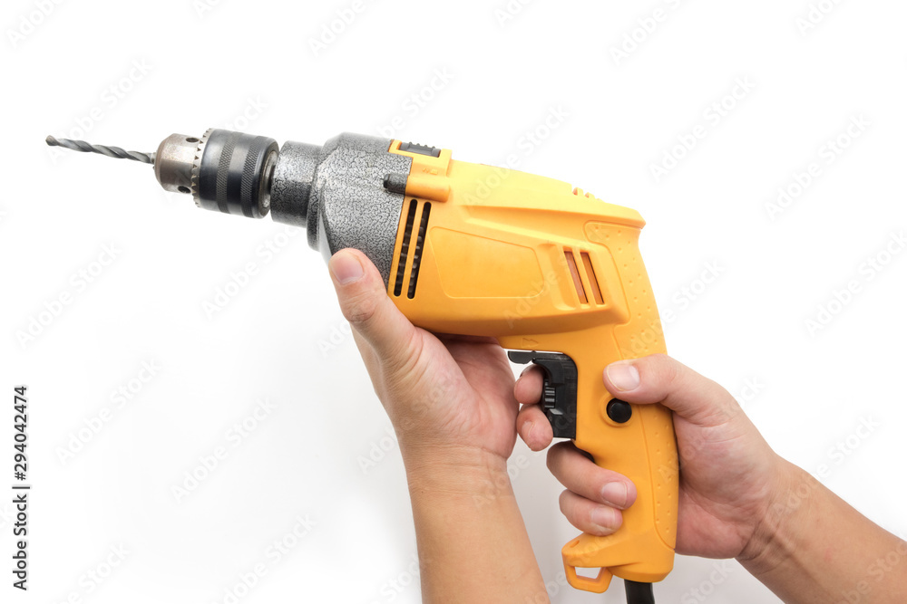 Handheld yellow household electric drill isolated on white background Handheld yellow household electric drill isolated on white background