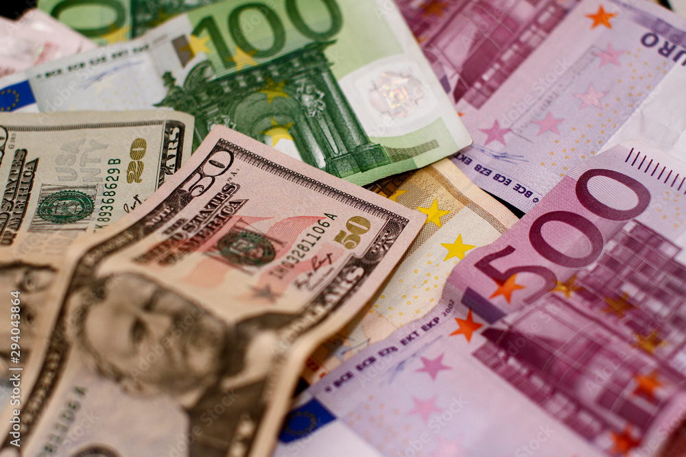 Dollar and Euro. Finance and Economy. Five hundred Euro and Fifty Dollars. Trading in USA and Europe Dollar and Euro. Finance and Economy. Five hundred Euro and Fifty Dollars. Trading in USA and Europe