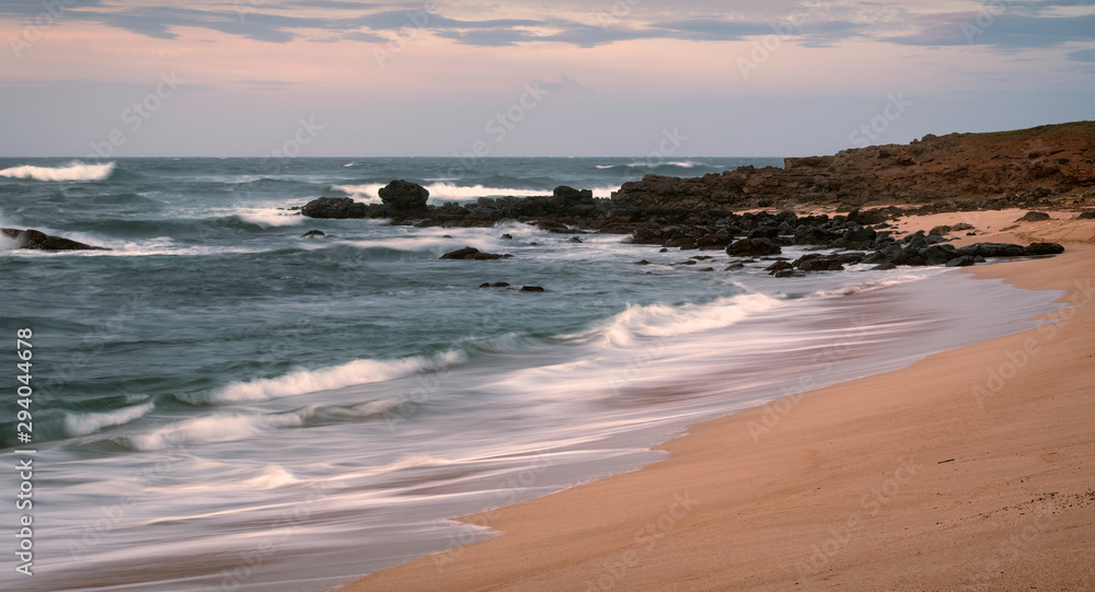 Long exposure of waves crashing on a beach. Image taken on the island of Molokai, Hawaii Long exposure of waves crashing on a beach. Image taken on the island of Molokai, Hawaii