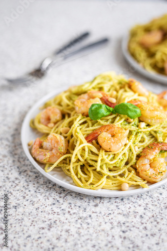 Spaghetti seafood pasta with prawns and basil. Pasta with pesto and prawns.