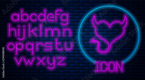 Glowing neon Devil heart with horns and a tail icon isolated on brick wall background. Valentines Day symbol. Neon light alphabet. Vector Illustration