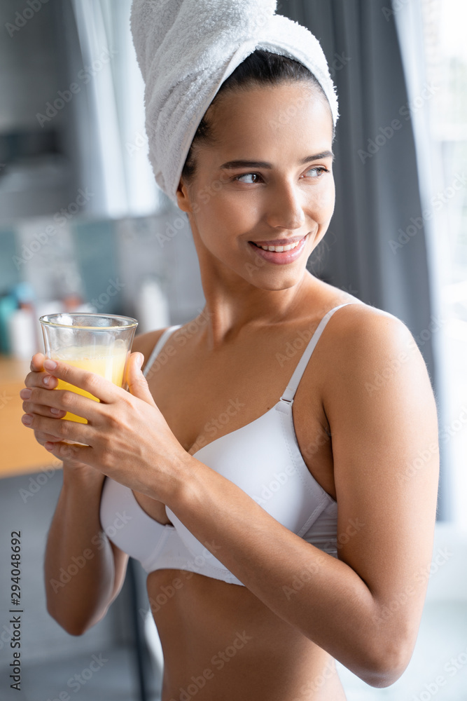 Pretty woman holding a glass of juice Pretty woman holding a glass of juice