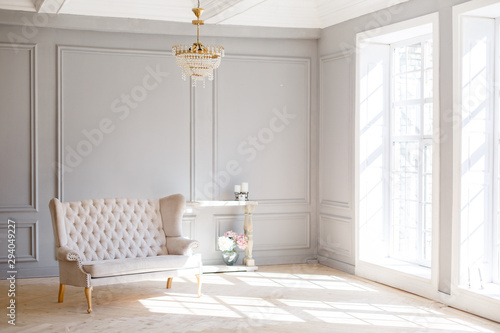 Obraz na płótnie Elegant soft arm-chair near a fireplace