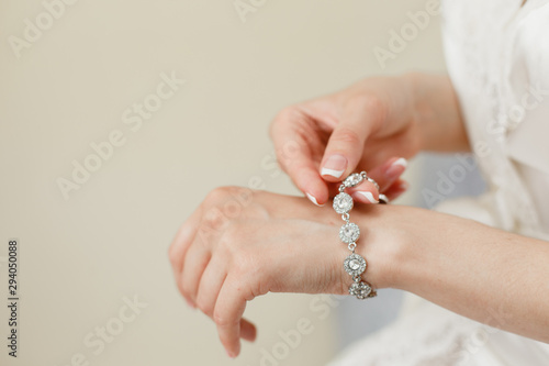 Murais de parede Woman's hands with perfect manicure with silver bracelet