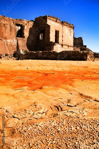 Abandoned quarry and orange Mineral sediments in a dry lake photo