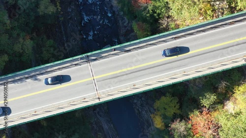 Quechee Gorge Bridge in Vermont during fall season. Aerial drone shot looking down. photo