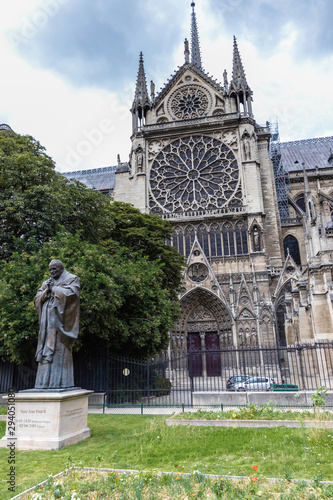 The Notre-Dame de Paris Cathedral and monument to Pope John Paul II photo