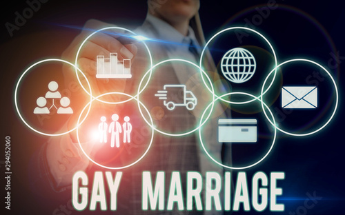 Writing note showing Gay Marriage. Business concept for entered into in a civil or religious ceremony of the same sex Woman wear formal work suit presenting presentation using smart device photo