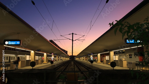 Sunset city railway station, view on the empty platform