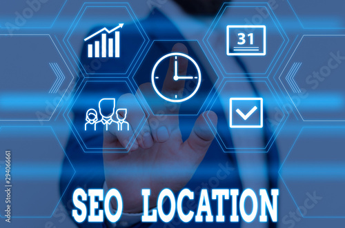Writing note showing Seo Location. Business concept for process to optimize pages on your site to show for organic Male wear formal work suit presenting presentation smart device