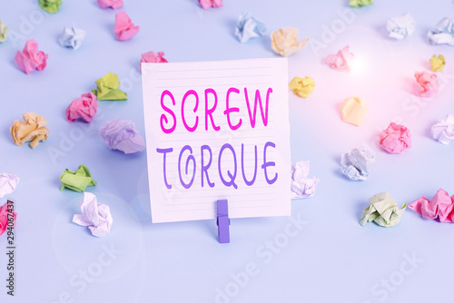 Conceptual hand writing showing Screw Torque. Concept meaning measure of the twisting force required to spin the nut Colored crumpled papers empty reminder blue floor clothespin © Artur
