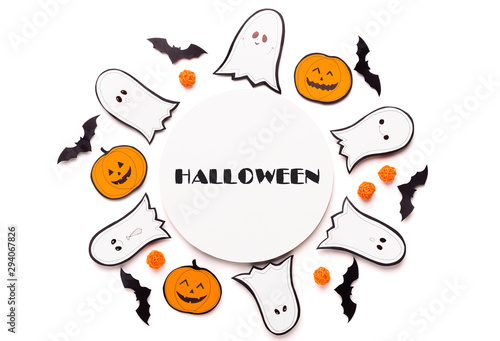 Round Composition of ghosts and pumpkins on white ,