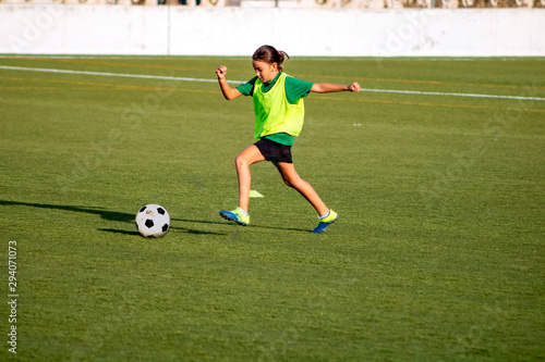 Little girl in a soccer training