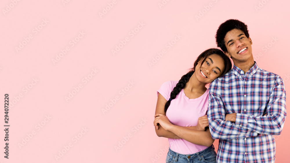 Couple smiling at camera, girl putting head on male shoulder Couple smiling at camera, girl putting head on male shoulder