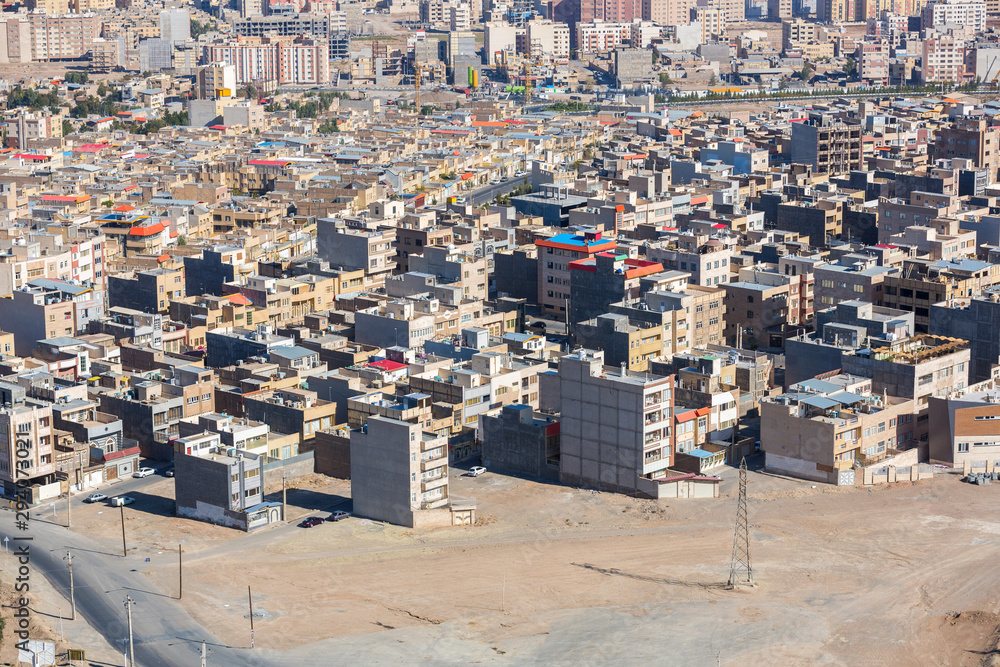 Panoramic view of the building density of Qom city, Iran. Dense urban development, unfinished houses, general view of the modern part of the city