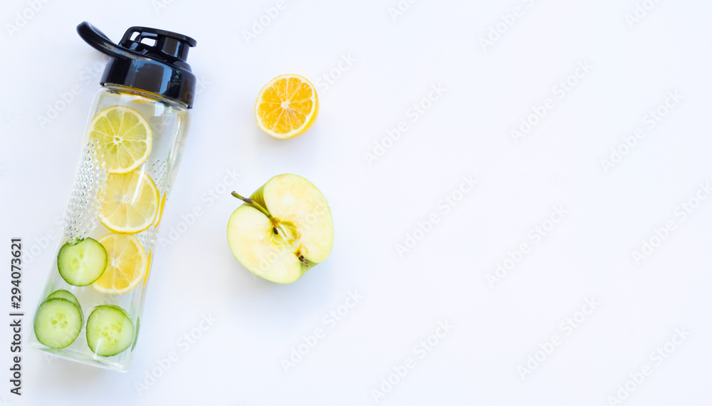 Healthy fruit water for sport, fitness. Bottle of water with lemon cucumber on white background 