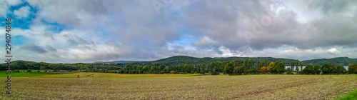 Panoramic view at a landscape with the lake Maria Laach, Germany