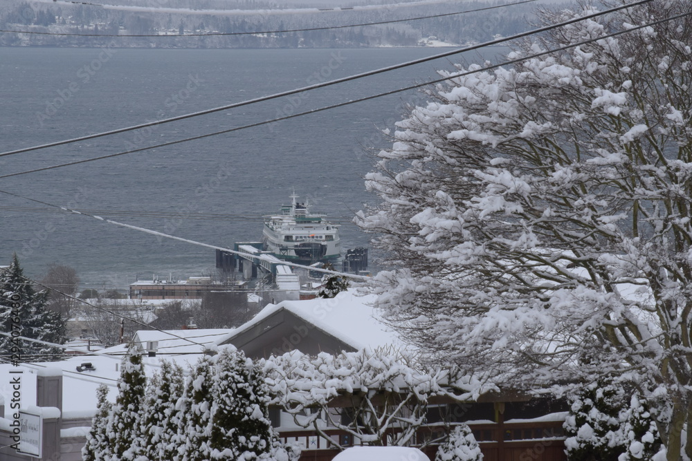 Fototapeta premium ferry docking after snow storm