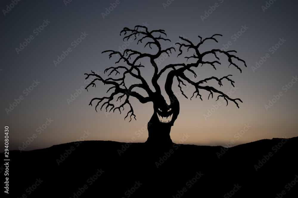 Silhouette some zombies on the cemetery walking around at sunset. Selective focus