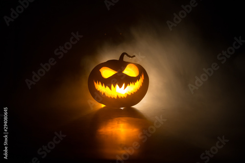 Fototapeta Halloween pumpkin smile and scary eyes for party night