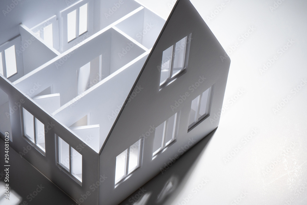 The design of the building. Layout of a two-story house. Concept - building new home. Layout of a cottage without a roof. Training of architects. Miniature prototype of the future home.Interior Design The design of the building. Layout of a two-story house. Concept - building new home. Layout of a cottage without a roof. Training of architects. Miniature prototype of the future home.Interior Design