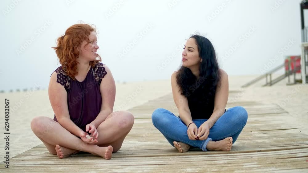 Girls enjoy their summer vacation at the beach - pure relaxing - slow motion shot Girls enjoy their summer vacation at the beach - pure relaxing - slow motion shot