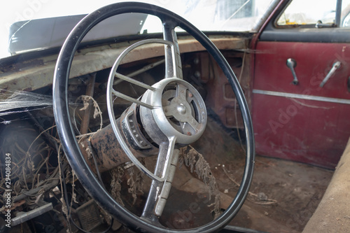 Steering wheel of an old abandoned rusty car