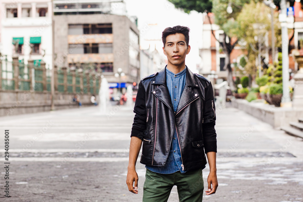 Obraz premium Mexican hispanic guy, portrait of young student man in Mexico city