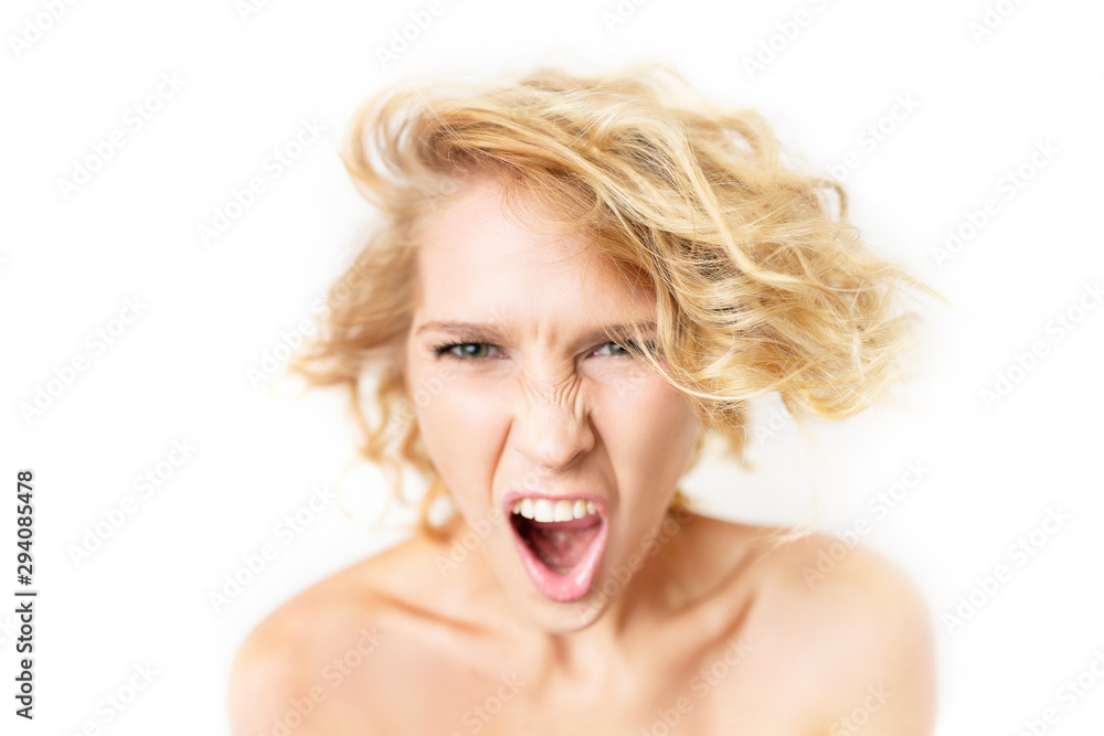 Closeup portrait of angry shouting woman with focus on hair and blurred face isolated at white background. Closeup portrait of angry shouting woman with focus on hair and blurred face isolated at white background.