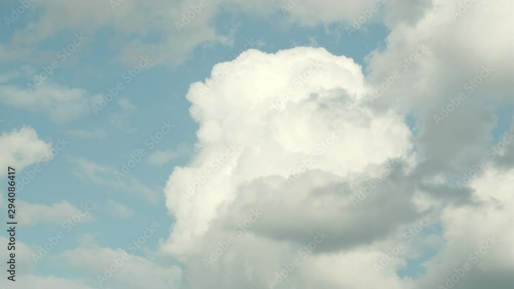 Video, Blue sky and clouds. Beautiful piling up clouds on a blue calm sky. Video, Blue sky and clouds. Beautiful piling up clouds on a blue calm sky.