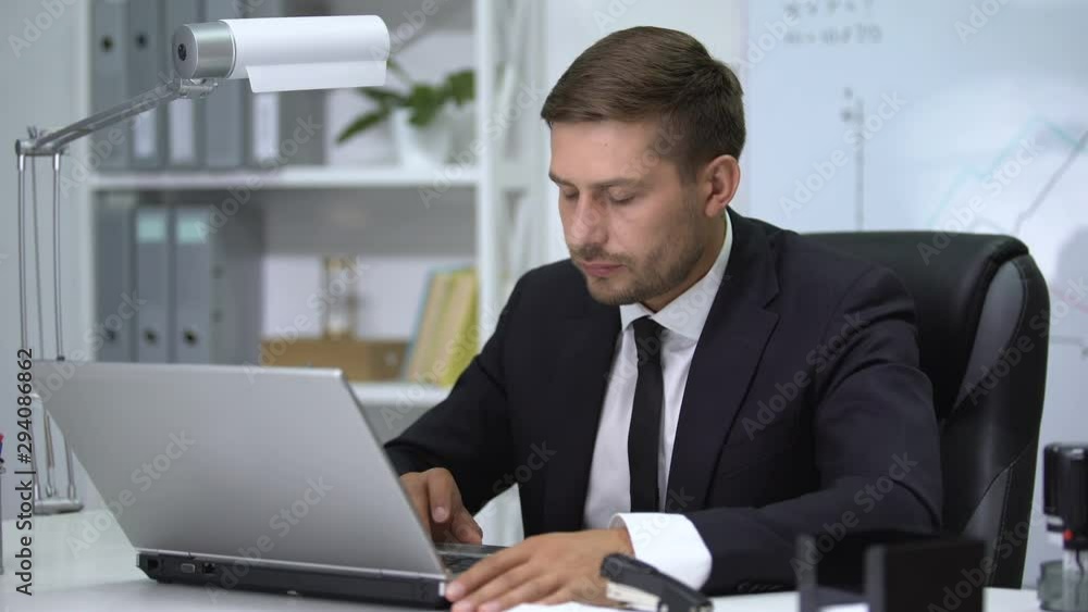Businessman working on laptop pc, feeling fever and loosening tie up, stress Businessman working on laptop pc, feeling fever and loosening tie up, stress