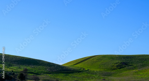 Landscape with hiking trails and clear sky © Wenli