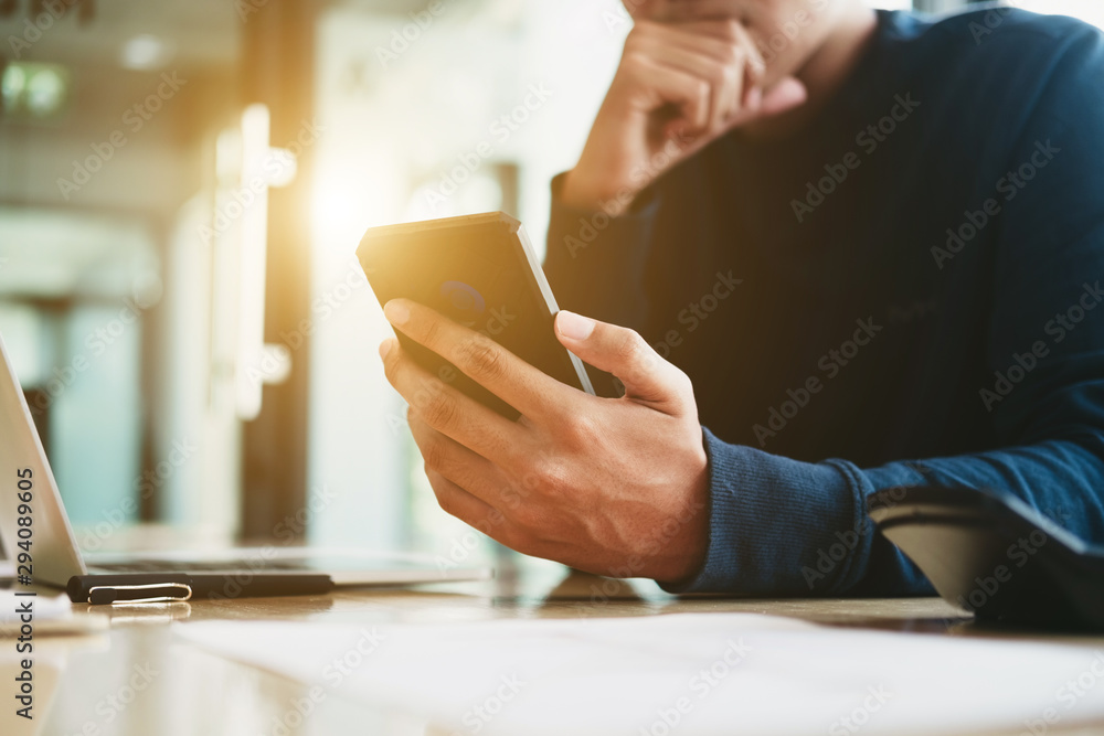 Business man analyzing investment graph and discussing plan in meeting room with smartphone, investment concept Business man analyzing investment graph and discussing plan in meeting room with smartphone, investment concept