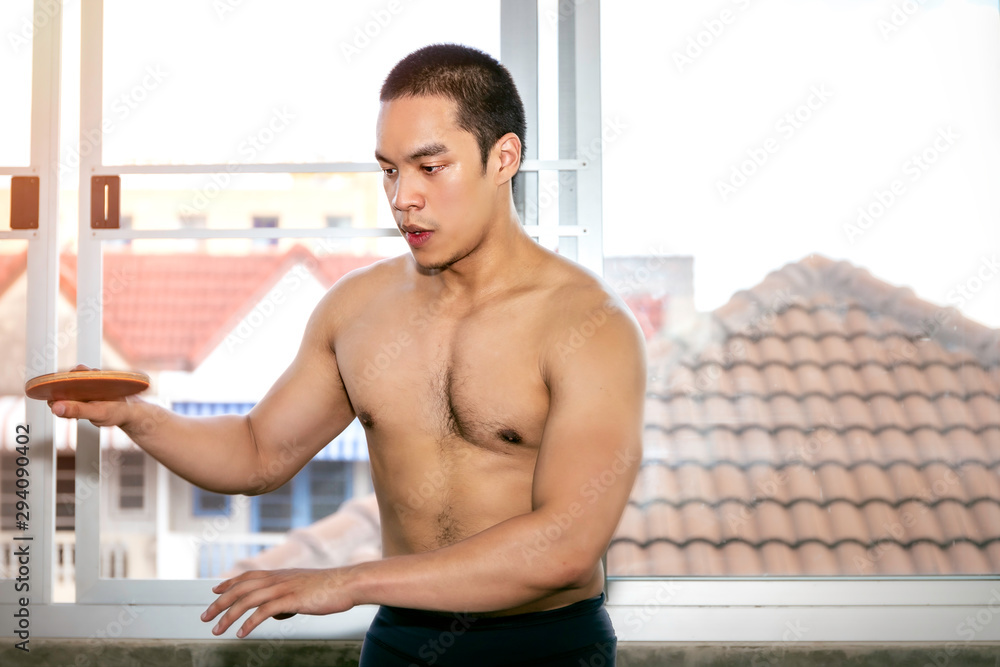 Obraz premium Athlete Asian man playing table tennis (Ping pong) on gym.