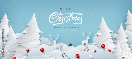 Winter christmas composition in paper cut style.Merry Christmas text Calligraphic Lettering Vector illustration. photo